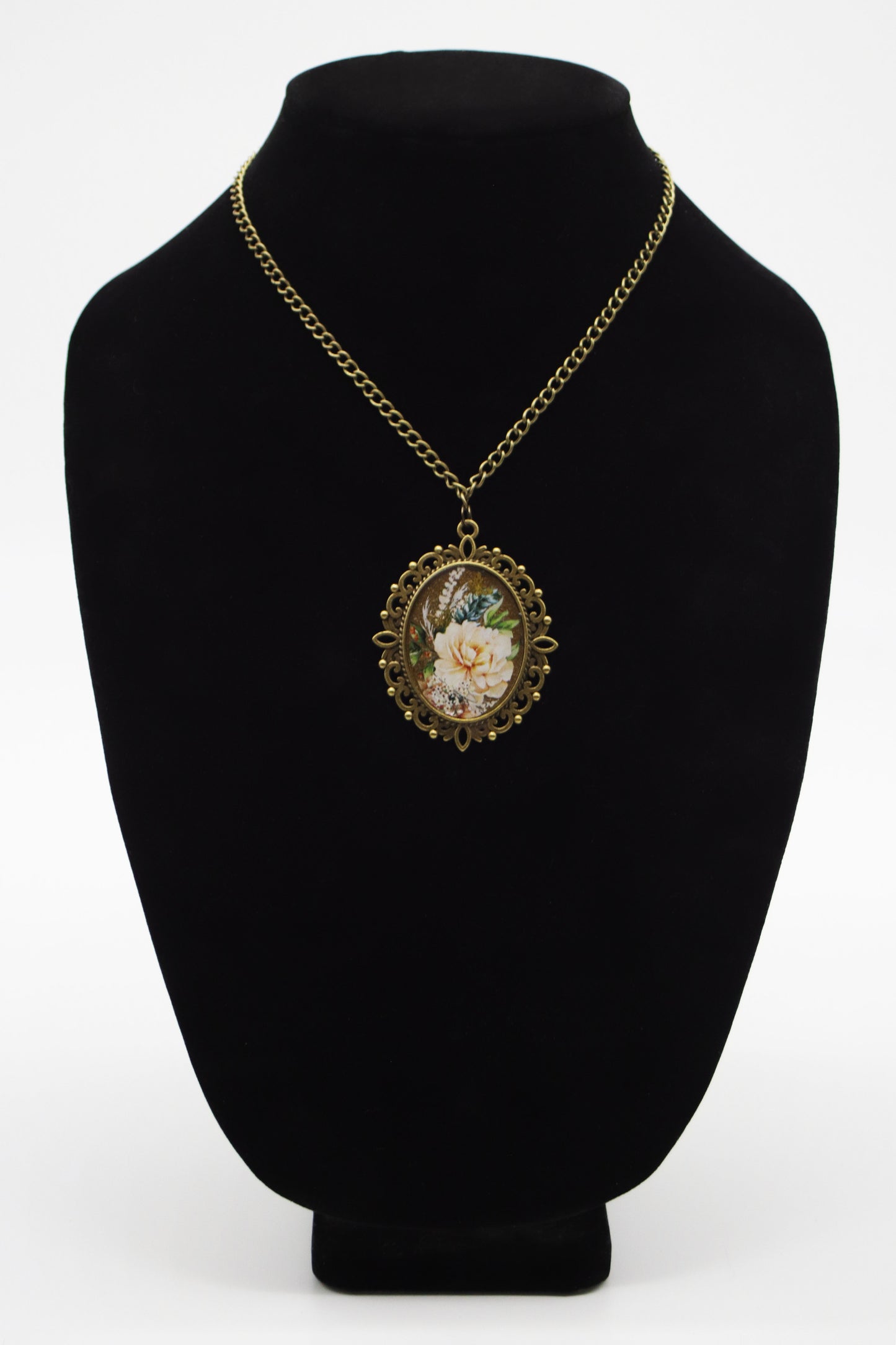 Antique bronze filigree oval resin necklace with cream peony washi tape art on jewelry bust