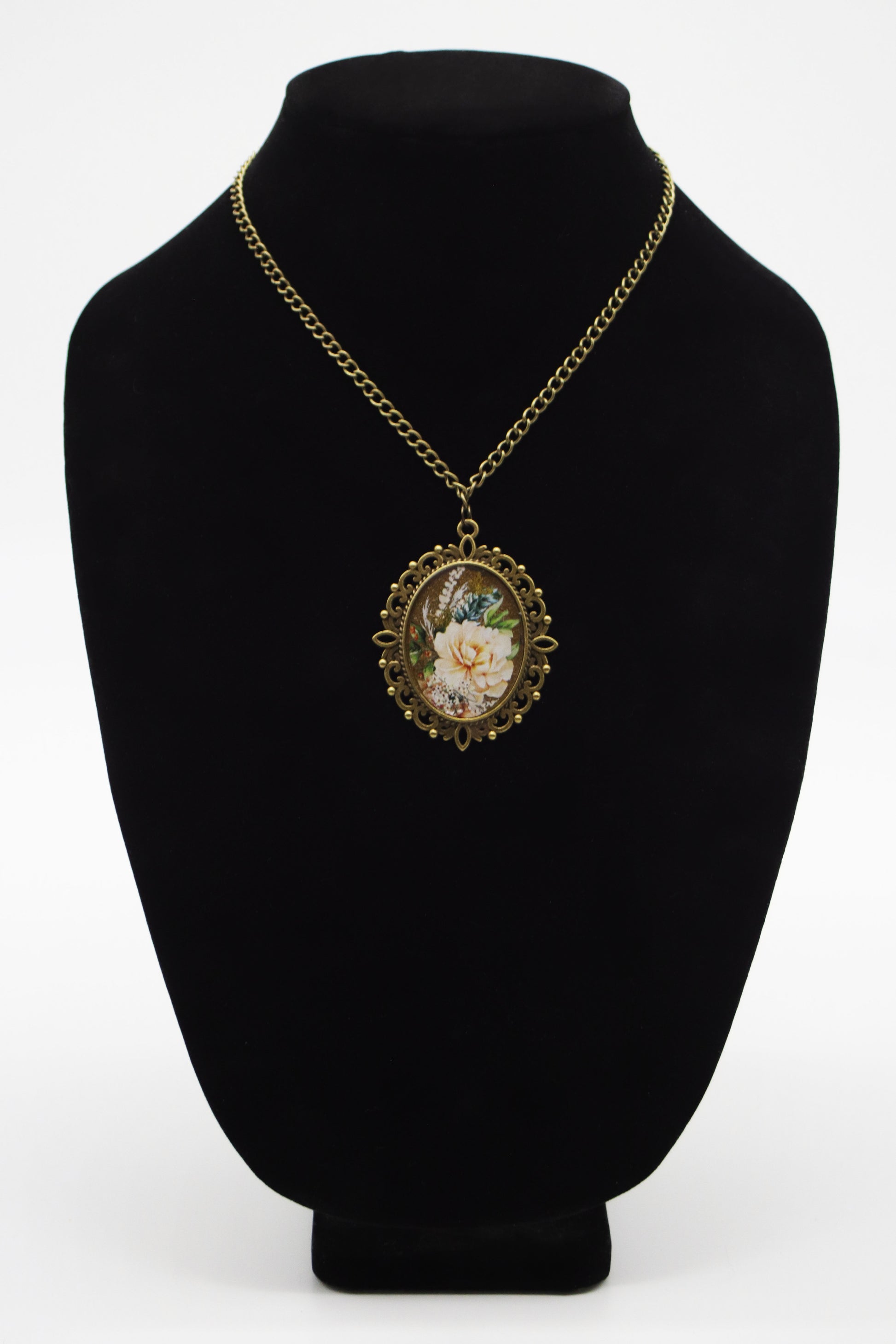 Antique bronze filigree oval resin necklace with cream peony washi tape art on jewelry bust