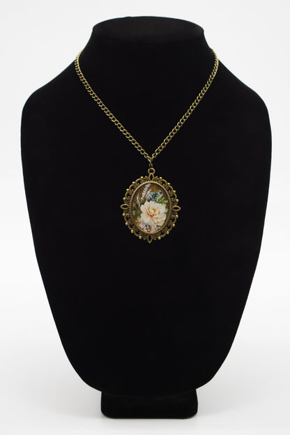 Antique bronze filigree oval resin necklace with cream peony washi tape art on jewelry bust