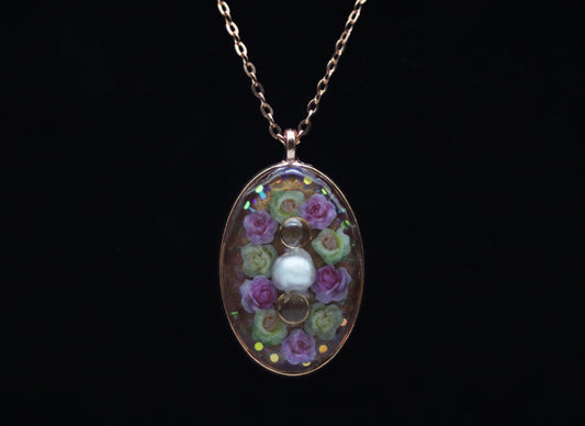 Rose gold oval resin necklace with pink and white wood flower roses and white pearl center accent